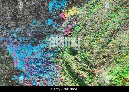 Colored chalk powder on the bitumen. Stock Photo