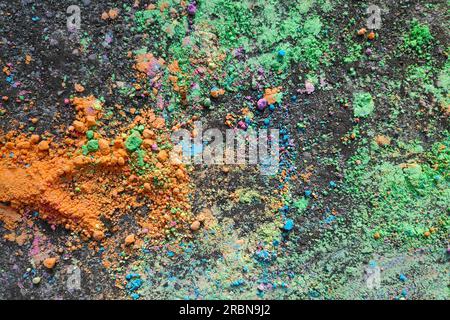 Colored chalk powder on the bitumen. Stock Photo