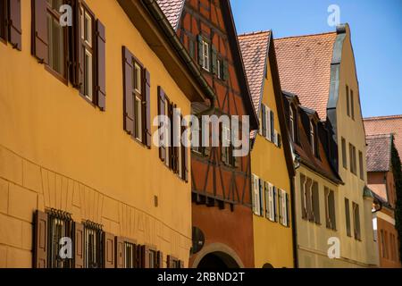 Reflected yellow light saturates the yellow color on buildings in the old town, Dinkelsbuehl, Franconia, Bavaria, Germany, Europe Stock Photo