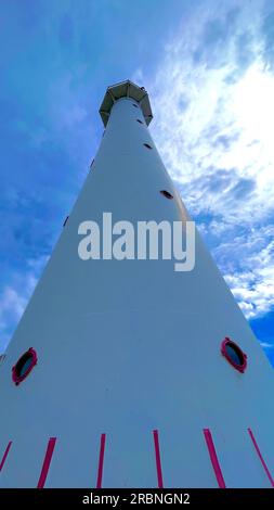 Lighthouse. Blue sky with clouds. Bottom view of the lighthouse Stock ...