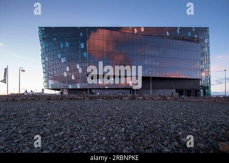 Reflection of sunset clouds on The Harpa concert hall at dusk, Reykjavik, Iceland, Europe Stock Photo