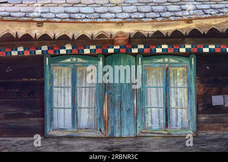 Detail of an old wooden house with traditional carved wood and painted decoration in the village of Cigoc. Lonjsko Polje Nature Park, Croatia. Stock Photo