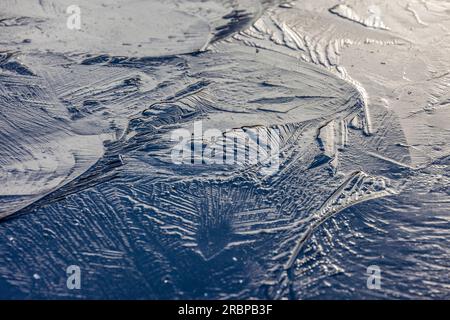 Ice patterns on the lake in the upper Theistal, Niedernhausen, Hesse, Germany Stock Photo