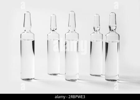 Medical ampules on light background Stock Photo