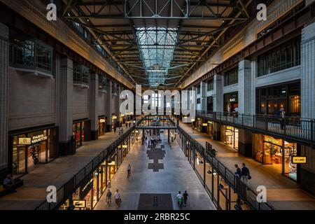 Battersea, London, UK: Battersea Power Station now redeveloped as a shopping and leisure destination. Interior of Turbine Hall A Stock Photo