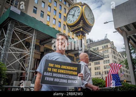 USA. 10th July, 2023. Members of the activist group Rise and Resist and allies gathered outside Trump Tower in Manhattan on July 10, 2023 demanding state governments to disqualify former President Trump from appearing on ballots in 2024 under the 14th Amendment. The group stated that secretaries of state are empowered by the 14th Amendment to bar Trump from running for office because of his incitement of the January 6, 2021 Capitol insurrection. (Photo by Erik McGregor/Sipa USA) Credit: Sipa USA/Alamy Live News Stock Photo