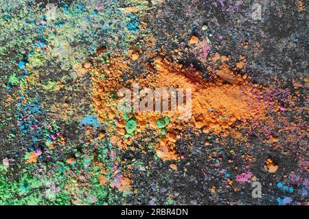 Colored chalk powder on the bitumen. Stock Photo