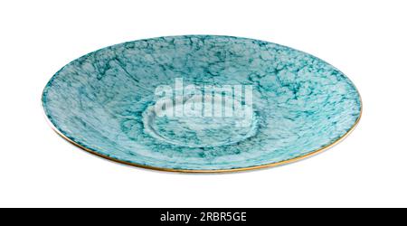 Empty turquoise saucer cutout. Beautiful porcelain dessert plate textured of blue marble isolated on a white background. Porcelain tableware. Stock Photo