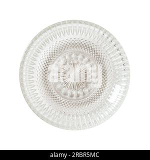 Empty cut glass dessert plate cutout. Beautiful vintage glass saucer isolated on a white background. Modern glass tableware. Empty plate concept. Stock Photo