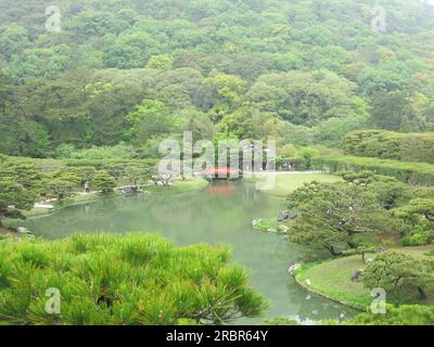 Japanese gardens to visit: Ritsurin strolling garden is one of the most beautiful in Japan, with vistas of ponds, arched bridges & cloud-pruned trees. Stock Photo