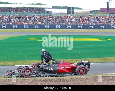 Kevin Magnussen climbs out of his broken down - Hass recovery at Stowe and Vale corners, Silverstone British F1 GP Qualifying 8th July 2023 Stock Photo