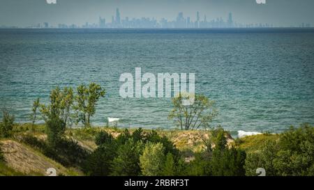 Chicago skyline viewed from over 30 miles (50 km) across Lake Michigan | Indiana Dunes National Park, Indiana, USA Stock Photo