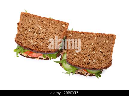 Delicious sandwiches with tuna and vegetables on white background Stock ...