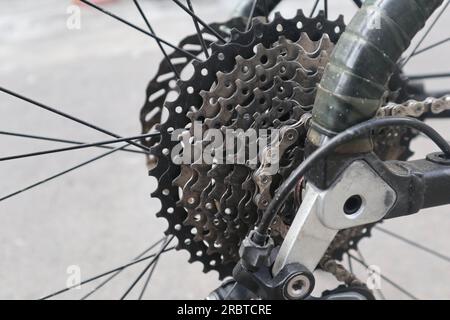 cassette and chain, Closeup bicycle gear wheels, mechanic gears cassette and chain at the rear wheel of folding bike Stock Photo