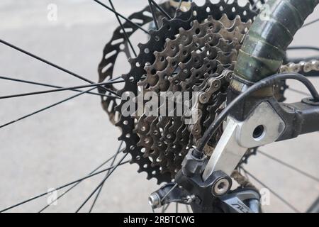 cassette and chain, Closeup bicycle gear wheels, mechanic gears cassette and chain at the rear wheel of folding bike Stock Photo