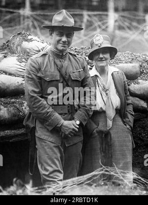 United States: c. 1917. A portrait of Col. William Hayward and noted sculptor Sally James Farnham standing in a trench where his troops train for the war in Europe. Hayward commands the 15th Infantry, the only African American Regiment in New York, and Farnham created a bronze equestrian statuette of Hayward in uniform on horseback. Stock Photo