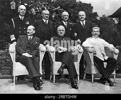 Potsdam, Germany:  August 10, 1945 The scene in the palace garden at Potsdam as the Big Three posed for photographers just before the final peace conference meeting. Seated left to right: Great Britain Prime Minister Clement Attlee, U.S. President Harry S. Truman, and Russian Marshal Josef Stalin. Standing left to right are: Admiral William Leahy, Chief of Staff to President Truman; Hon. Ernest Bevin, Brtain's Foreign Minister; U.S. Secretary of State James Byrnes; and Russia's Foreign Minister Vyacheslav Molotov. Stock Photo