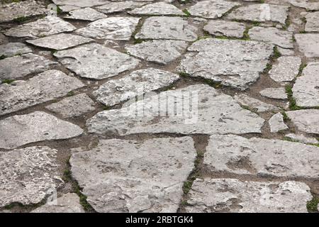 Old gray stone pavement, background photo texture Stock Photo