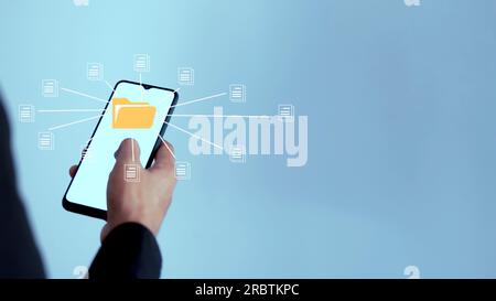 Businessman touch folder and document icon software on a smartphone, search and manage files online document database Stock Photo