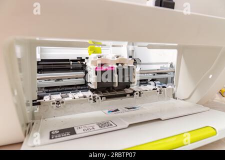 Itaja, Goias, Brazil - 09 05 2023: Open home multifunction printer for maintenance electronic components Stock Photo