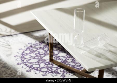 Vases and objects on the table in a warm room with sunlight coming in Stock Photo