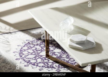 Vases and objects on the table in a warm room with sunlight coming in Stock Photo