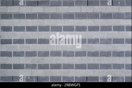 Wall made from rows of white and gray bricks usable as background or texture. Stock Photo