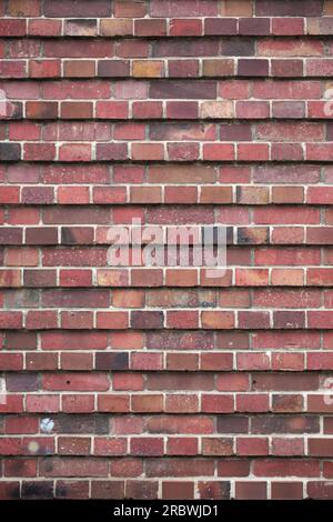 Red brick texture in layers with different prominence. Stock Photo