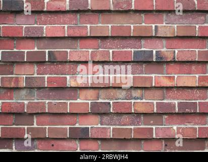 Red brick texture in layers with different prominence. Stock Photo