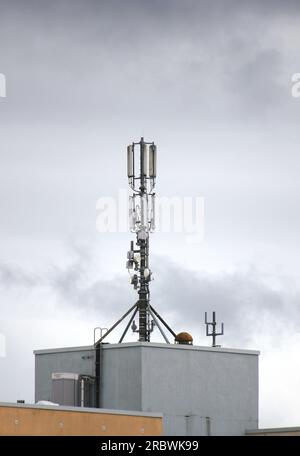 Telecommunications tower on a building. Stock Photo