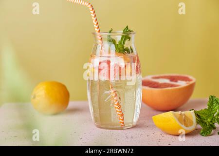 Summer aesthetic fresh drink with citrus. Detox vitaminized water. Low alcohol, hard seltzer, zero proof beverages. Stock Photo