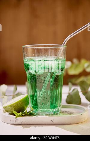 Aesthetic lime healthy tarragon detox sparkling cocktail. Non alcoholic vitaminized healthy beverage. Green Mocktail for St. Patricks Day Stock Photo