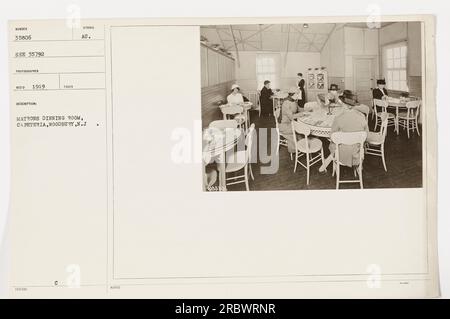 This image is from a series of photographs of American military activities during World War One. The photograph, numbered 35806, was taken in 1919 by a photographer named Red. The image shows the matrons' dining room in a cafeteria in Woodbury, New Jersey. The photo is labeled as A5806. Stock Photo