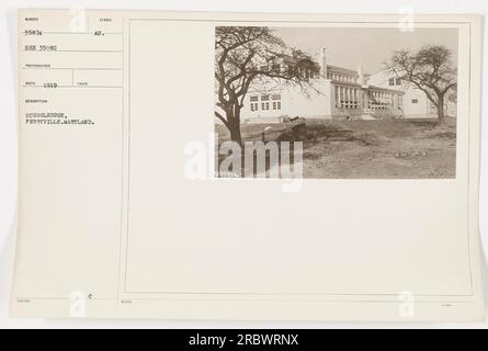 The image shows a schoolhouse in Perryville, Maryland, taken in 1919. It is numbered 35874 and taken by photographer NECO. The symbol AU is also associated with the image. Stock Photo