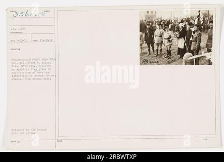 Maj. Gen. Henry T. Allen of the 90th Div. receiving an American flag as a token of gratitude for liberating Mousay, Meuse, France from German occupation during World War I. The photograph was taken on November 15, 1918, and released by the AEP censor. Caption notes: 35612. Stock Photo