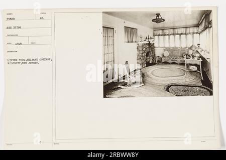 Soldiers taking a break in a living room at a cottage in Woodbury, New Jersey during World War One. The photograph was taken in 1919 and is part of a series of photographs documenting American military activities during the war. Stock Photo