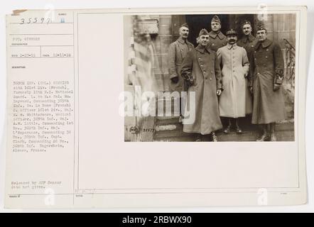 Members of the 369th Infantry, also known as the 'Harlem Hellfighters,' serving with the 161st Division (French) during World War I. From left to right: Colonel W. Hayward, commanding officer of the 369th Infantry; General Le Boue, a French officer of the 161st Division; Major E.W. Whittermore, medical officer of the 369th Infantry; Major A.W. Little, commanding officer of the 1st Battalion; Major L'Esperance, commanding officer of the 3rd Section; and Captain Clark, commanding officer of the 2nd Battalion. Location: Ungersheim, Alsace, France. Photograph taken on December 11, 1916. Stock Photo