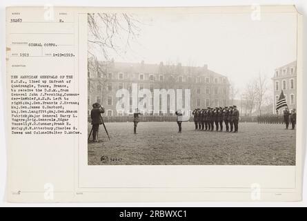 'W.W. Atterbury, Charles G. Dawes, and Colonel Walter D. McCaw, among other American generals, line up in front of the Quadrangle in Tours, France, to receive the Distinguished Service Medal from General John J. Pershing, Commander-in-Chief of the A.E.F, in January 1919.' Stock Photo