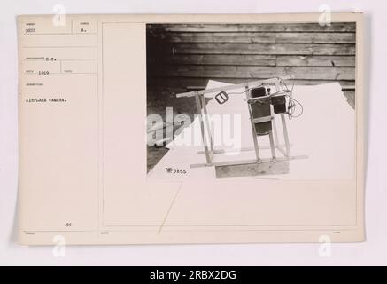 An image showcasing an airplane camera used during World War One. This particular camera is identified with the code MUN 9855 PATOGRAPE S.C. and was produced in 1919. The image shows the camera mounted in an airplane, highlighting its role in aerial photography for military activities. CC A. Stock Photo