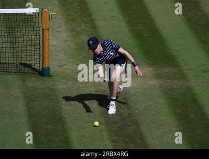 Wimbledon, UK. 11th July 2023; All England Lawn Tennis and Croquet Club, London, England: Wimbledon Tennis Tournament; Ball boy passes the ball to the service area  mens doubles round of 16 Credit: Action Plus Sports Images/Alamy Live News Credit: Action Plus Sports Images/Alamy Live News Stock Photo