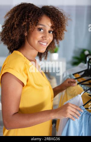 home woman choosing her fashion outfit in dressing room Stock Photo