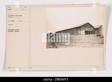 Workers at the Engineers Depot in Gievres, France, during World War I. The photograph was taken by the A.E.F. Photo Lab photographer in 1918. The image shows individuals engaged in various activities at the depot. The photo bears the C Symbol E and is part of the 10123 series. The description notes that it was taken on October 23. Stock Photo