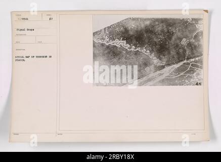 An aerial photograph showing a map of trenches in France during World War I. This image, taken by the Signal Corps, provides a bird's eye view of the intricate network of trenches used by the military. The photograph is labeled as '111-SC-8541' and has the description 'Aerial view of trenches in France.' The photographer is unknown. Stock Photo