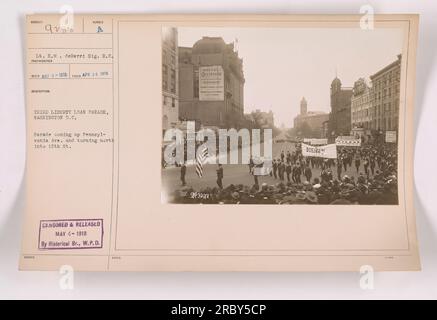 World War One image featuring Lieutenant E.M. deBerri, taken by Sig. R.C. Photographer on April 26, 1918. The photo captures the Number A Third Liberty Loan Parade in Washington D.C. The parade can be seen on Pennsylvania Ave. turning north into 15th St. The image was censored and released on May 4, 1918, by the Historical Branch, W.P.D. Noteworthy landmarks in the background include the Hotel Occidental and Buen Restaurant. Stock Photo