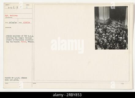 Image shows Jewish soldiers of the U.S.A. entering a temple in Paris, France. The photo was taken on September 16, 1918, and was captured by Sgt. Gallivan. This event occurred during Yom Kippur, and the soldiers are seen passing through a crowd of Parisians who are celebrating the holiday. The photograph was passed by the A.E.P. censor but unfortunately, the specific date of its issue is unknown. Additional notes exist but they were not provided. Stock Photo