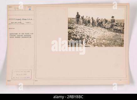 American soldiers in the first contingent are seen here digging trenches under French instruction during World War One. The image was taken on March 26, 1918, by a photographer from the Signal Corps. It was censored and released by the War College division on March 23, 1918. Stock Photo