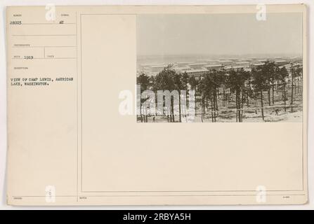 Soldiers at Camp Lewis in American Lake, Washington, during World War One. This view shows a group of soldiers engaged in various activities at the camp. Camp Lewis played a vital role in training and preparing American troops for deployment during the war. Stock Photo