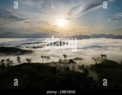 Beautiful morning Sunrise and sea of fog flow over  Khao Jang Lone mountain, Nakhon si Thammarat,  Thailand Stock Photo
