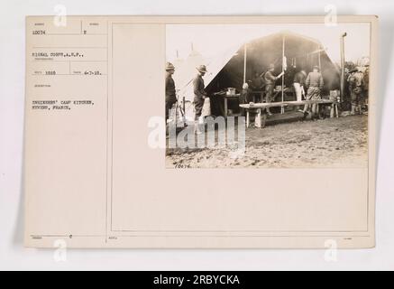 Engineers' camp kitchen in Nevers, France. This photograph, numbered 10074, was taken on 4-7-18 by the Signal Corps of the American Expeditionary Forces (A.E.F.). The image shows the camp kitchen belonging to the engineers in Nevers, France. Note: The photograph has the number 70074. Stock Photo