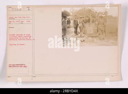 Instruction in balloon observation being received by student officers of the Coast Artillery School at Fortress Monroe, Virginia. The image depicts the student officers toggling on the basket. The photograph was taken by Lieutenant Wm. Pox of the Signal Reserve Corps on May 18, 1918. This image is not to be published and is strictly for official use only. Stock Photo